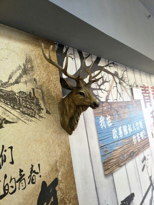 A luxurious deer head handmade from resin material for hanging on the wall